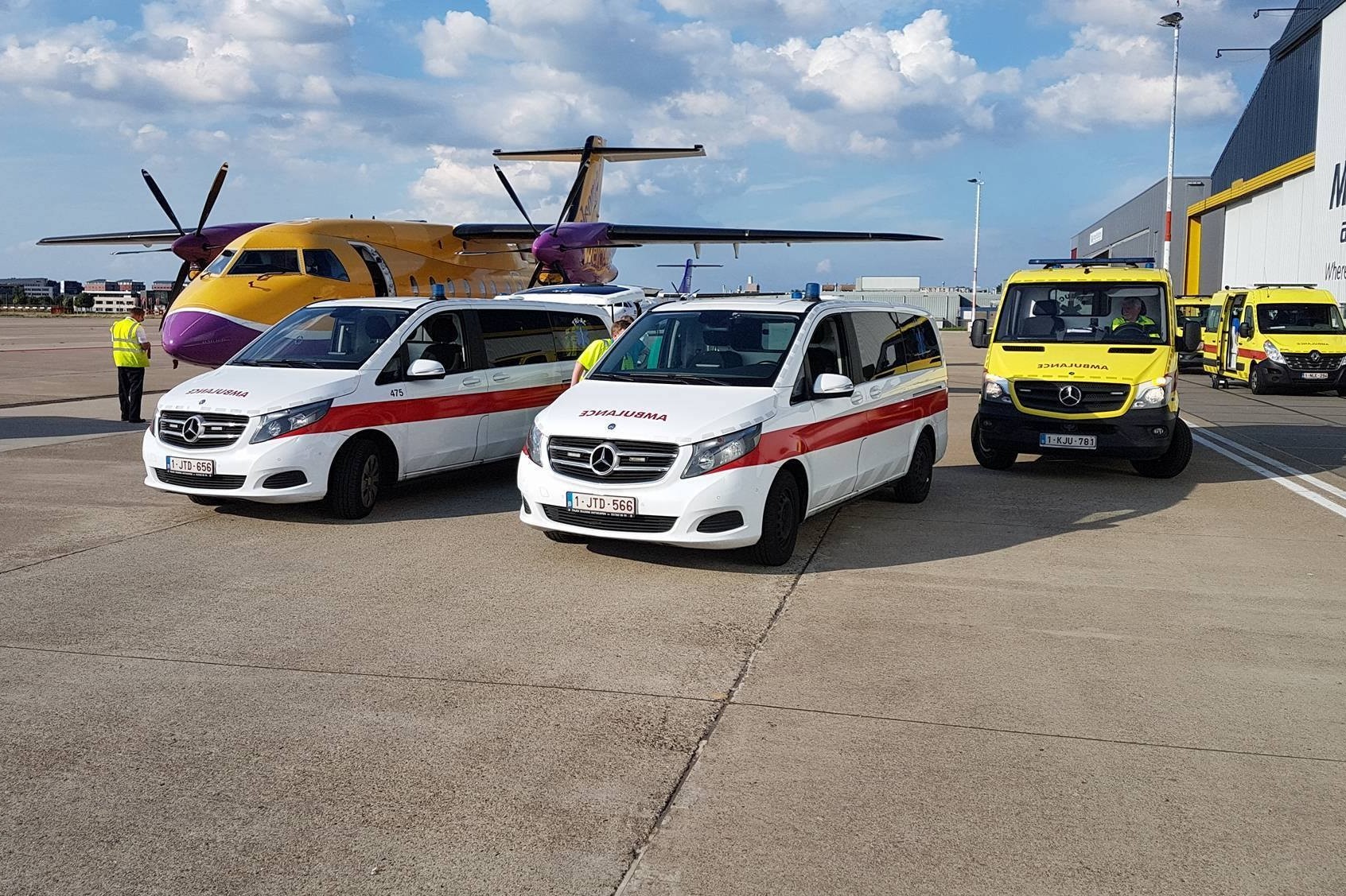 Ambulances and ambulance airplane on an airstrip